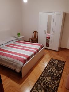 A bed or beds in a room at Miniappartamento Singolo