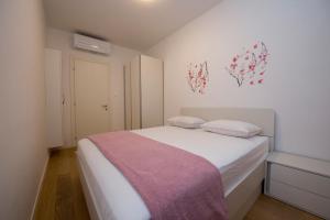 Katil atau katil-katil dalam bilik di Sea view apartment Ema