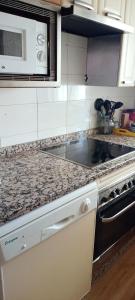 a kitchen with a sink and a counter top at EL DESVÁN in Santa Marta de Tormes