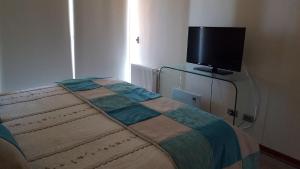 TV a/nebo společenská místnost v ubytování Apartamento Deluxe Edificio Torremar, frente al Mall Marina Arauco