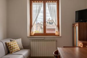Televízia a/alebo spoločenská miestnosť v ubytovaní Casa in Chiana