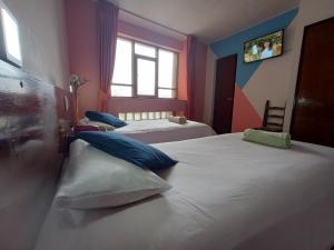 Katil atau katil-katil dalam bilik di Isabela Hotel