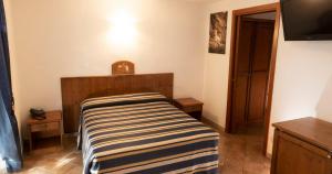 Postel nebo postele na pokoji v ubytování Hotel Residence Chateau