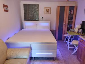 Posteľ alebo postele v izbe v ubytovaní Cseresznyés apartman