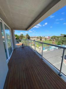 a balcony with a view of a parking lot at Depto. Con vista al mar a estrenar in Mar del Plata