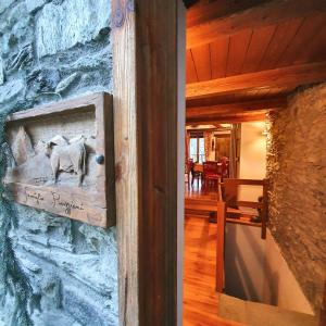 a painting of a cow on a stone wall at CHALET DI MONTAGNA, Valtournenche-Cervinia in Valtournenche