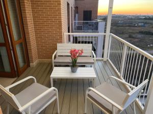 A balcony or terrace at AGM Suite Rome Airport FCO - Attico Parco Leonardo