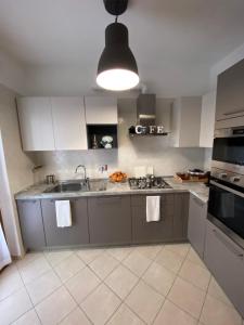 A kitchen or kitchenette at AGM Suite Rome Airport FCO - Attico Parco Leonardo