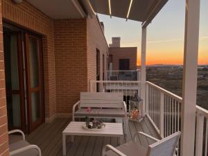 A balcony or terrace at AGM Suite Rome Airport FCO - Attico Parco Leonardo