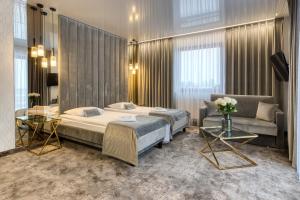 Postel nebo postele na pokoji v ubytování Hotel & Spa Biały Dom + 37 fotografií