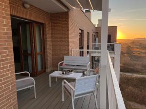 A balcony or terrace at AGM Suite Rome Airport FCO - Attico Parco Leonardo