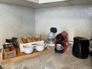 Coffee and tea making facilities at AGM Suite Rome Airport FCO - Attico Parco Leonardo
