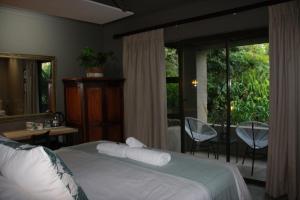 Green Pascua Bed and Breakfast客房内的一张或多张床位