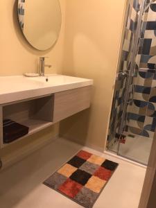 a bathroom with a sink and a mirror and a shower at Marvest Hua Hin flat B 208 3.fl. Betw.Soi 78-80 in Hua Hin