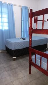 Uma cama ou camas num quarto em Pousada Alexandrina
