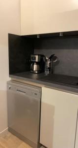 a kitchen with a coffee pot on a counter at MEET - AIRBUS - TRAMWAY in Aussonne