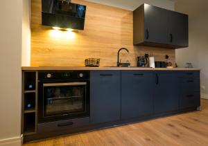 Kuchyňa alebo kuchynka v ubytovaní Apartament A7