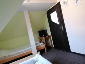 En eller flere senge i et værelse på Noclegi Hrubieszów + 5 billeder