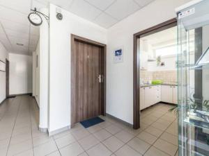 a hallway with a wooden door in a room at Pokoje Tanie Spanie in Zator +11 photos