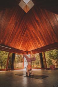 a man is dancing in a room with a ceiling at KANTU GARDEN LODGE in Moyobamba