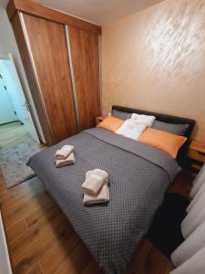 Posteľ alebo postele v izbe v ubytovaní Apartman Kristal