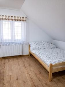 Posteľ alebo postele v izbe v ubytovaní Agroturystyka u Aleksa