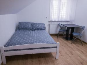 Łóżko lub łóżka w pokoju w obiekcie Agroturystyka u Aleksa