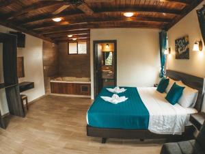 Postel nebo postele na pokoji v ubytování Toucan Platinum Suites Aparthotel