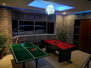 a ping pong table in a ping pong room at McHanns Place in Antipolo