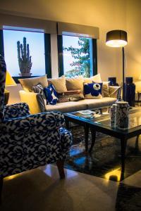 a living room with a couch and a coffee table at Kalidon Panorama Hotel in Kokkari
