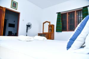 Postel nebo postele na pokoji v ubytování Villa leela