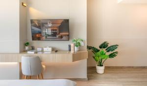 TV a/nebo společenská místnost v ubytování 56 Hotel