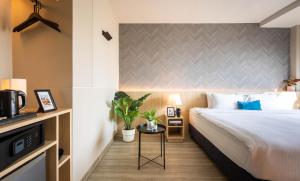Postel nebo postele na pokoji v ubytování 56 Hotel
