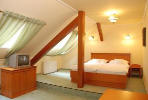 
Posteľ alebo postele v izbe v ubytovaní Hotel Most Slávy
