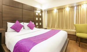 Postel nebo postele na pokoji v ubytování Hotel Metropolis