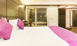 Postel nebo postele na pokoji v ubytování Hotel Metropolis