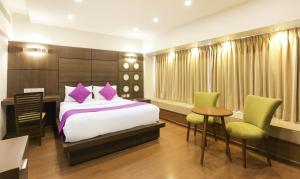 Postel nebo postele na pokoji v ubytování Hotel Metropolis