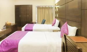 Postel nebo postele na pokoji v ubytování Hotel Metropolis