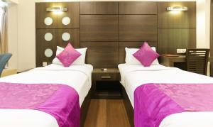 Postel nebo postele na pokoji v ubytování Hotel Metropolis