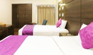 Postel nebo postele na pokoji v ubytování Hotel Metropolis