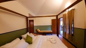 Ένα ή περισσότερα κρεβάτια σε δωμάτιο στο Avadale Masinagudi - Stag Groups Not Allowed