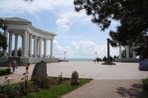 a large building with columns in front of the ocean at Двухкомнатная квартира 500м от моря ул Парковая отчетные док in Chornomorsk