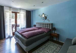 Кровать или кровати в номере Pension Villa Louise