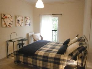A bed or beds in a room at Il Bosco di Campo Marzano green & sky