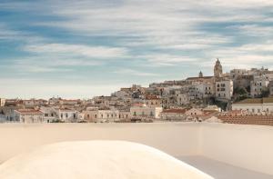 a view of a city from the roof of a building at Casa Pinta Rooms in Vieste