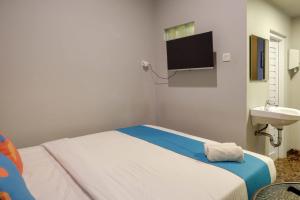 Koupelna v ubytování Sans Hotel Empress Simpang Lima