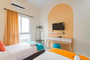 Postel nebo postele na pokoji v ubytování Sans Resort Parung Bogor