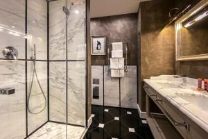 a bathroom with a shower and a sink at Hotel Villa Carlotta in Taormina