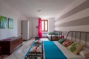 Postel nebo postele na pokoji v ubytování Ciao Bella COLORS