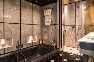 a bathroom with a shower and a sink at Hotel Villa Carlotta in Taormina